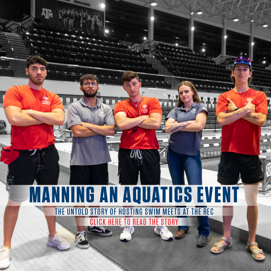 5 aquatics students are standing inside the Student Rec Center Natatorium. They are standing side by side with their arms crossed. At the bottom of the design it states "Manning an Aquatics event, the untold story of hosting swim meets at the rec. Click here to read the story."