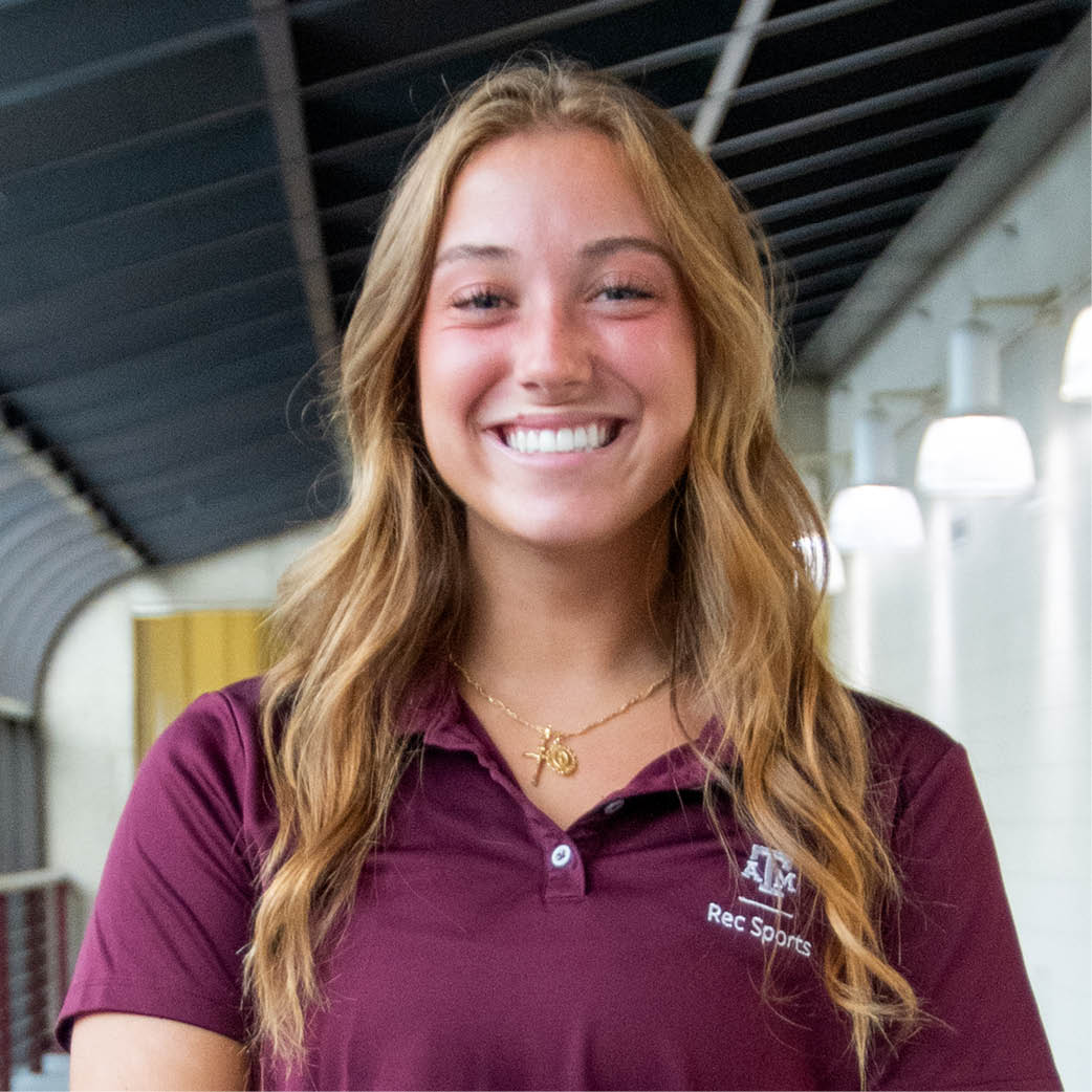 Portrait of Lola Kiliddjian standing on the track in the student rec center