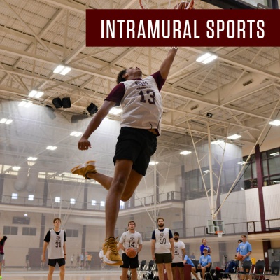 Student playing basketball on the courts within the Student Rec Center. In the top right corner it says Intramural Sports.