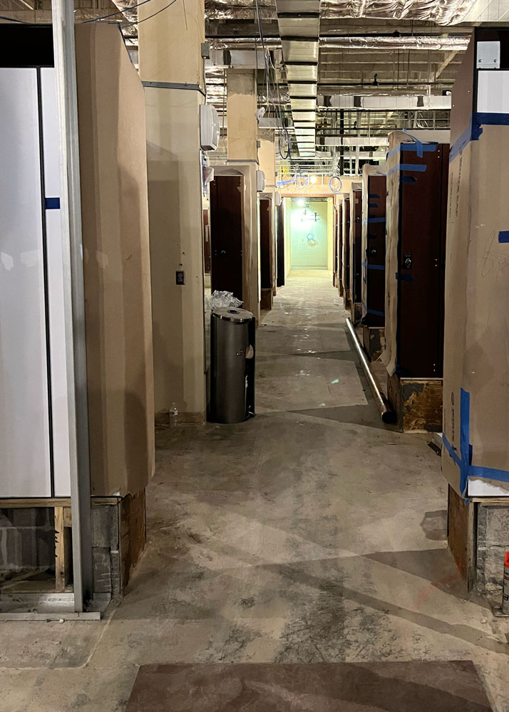 Under construction view of the entry hallway to the locker room