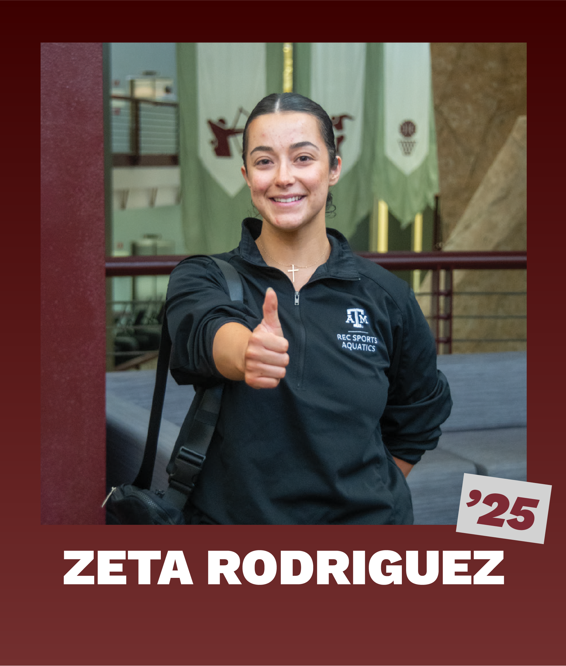 Zeta Rodriguez '25, wearing a Texas A&M Rec Sports Aquatics jacket, gives a thumbs up inside the Student Rec Center with banners in the background.
