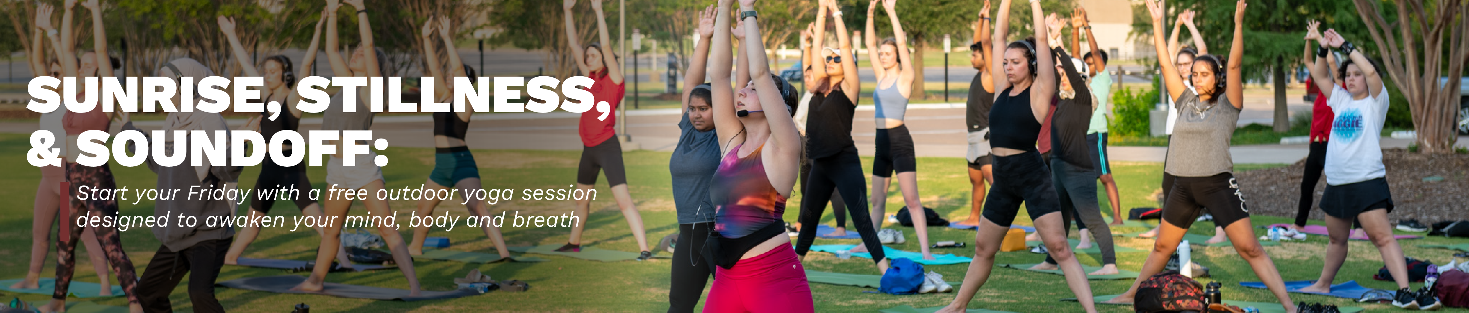 Group of individuals participating in an outdoor yoga session at sunrise, promoting mental and physical well-being.