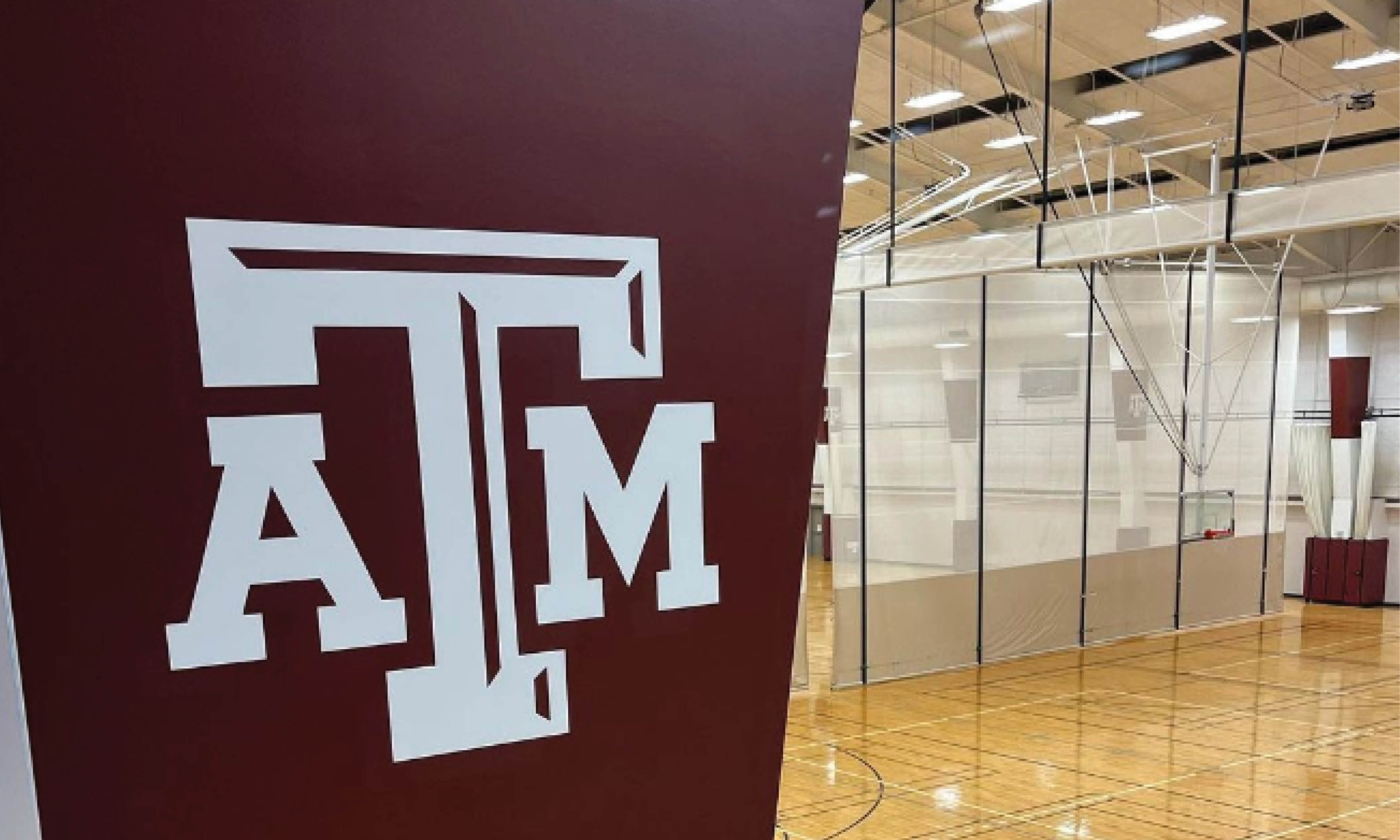 The texas a & m aggies logo is on the wall of the courts in PEAP.