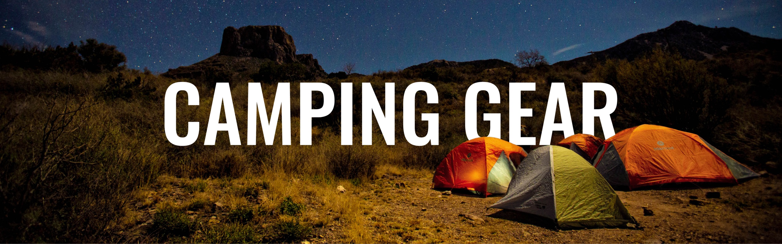 Photo of three tents set up at a park at night with text in the background saying camping gear.
