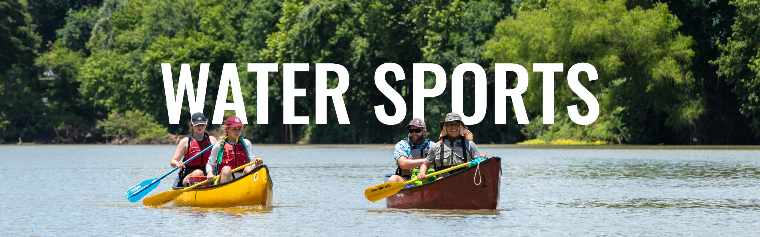 two kayaks are on a river with two people in each kayak with "Water Sports" written across the image