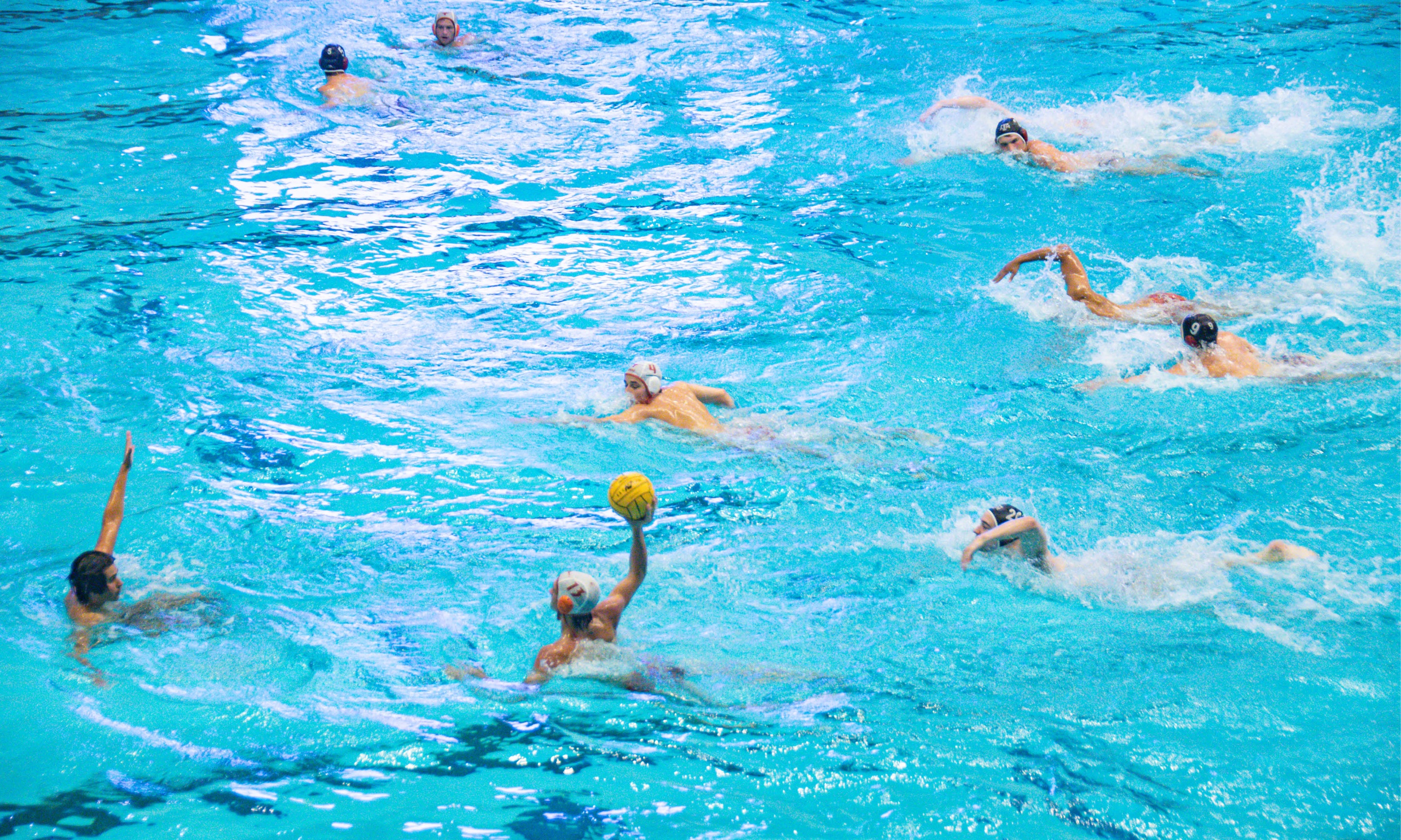 Men's polo is playing a match in the Natatorium inside the Student Rec Center.