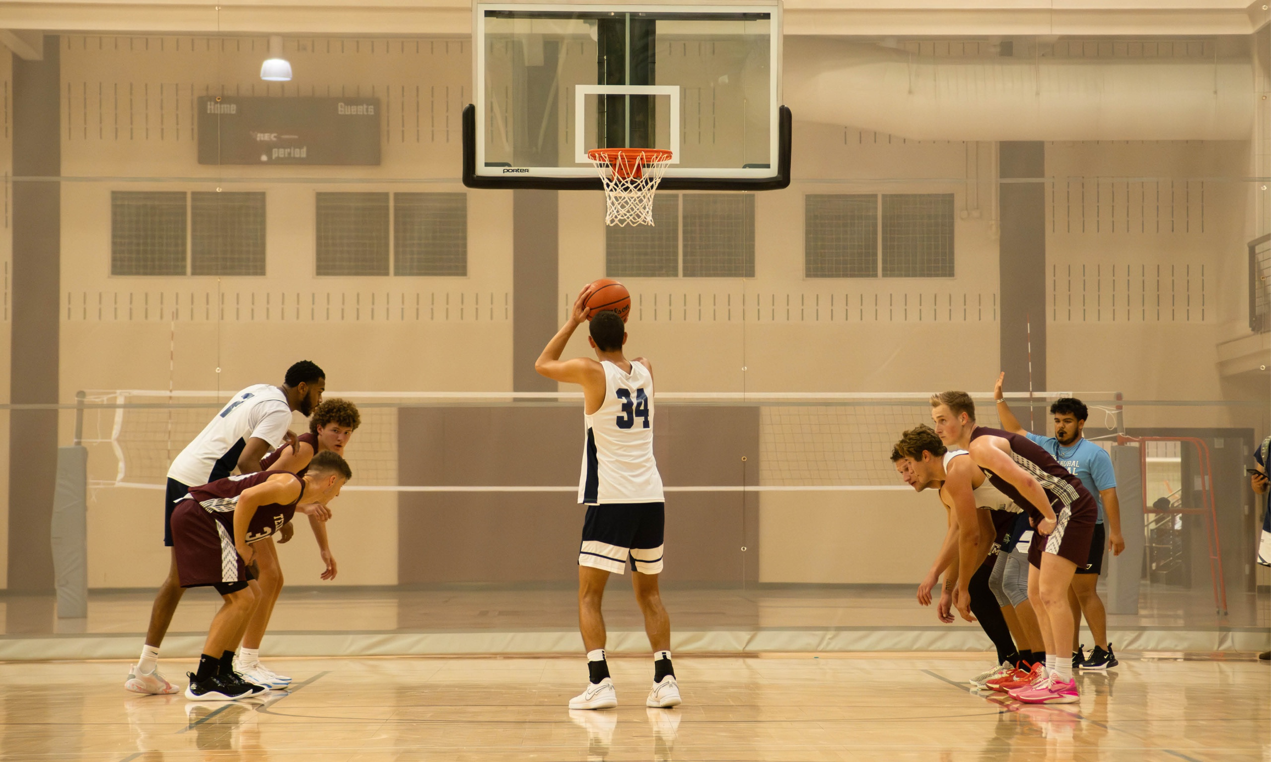 Texas A&M Mens Club basketball team shooting free throws at a game inside the Student Rec Center.