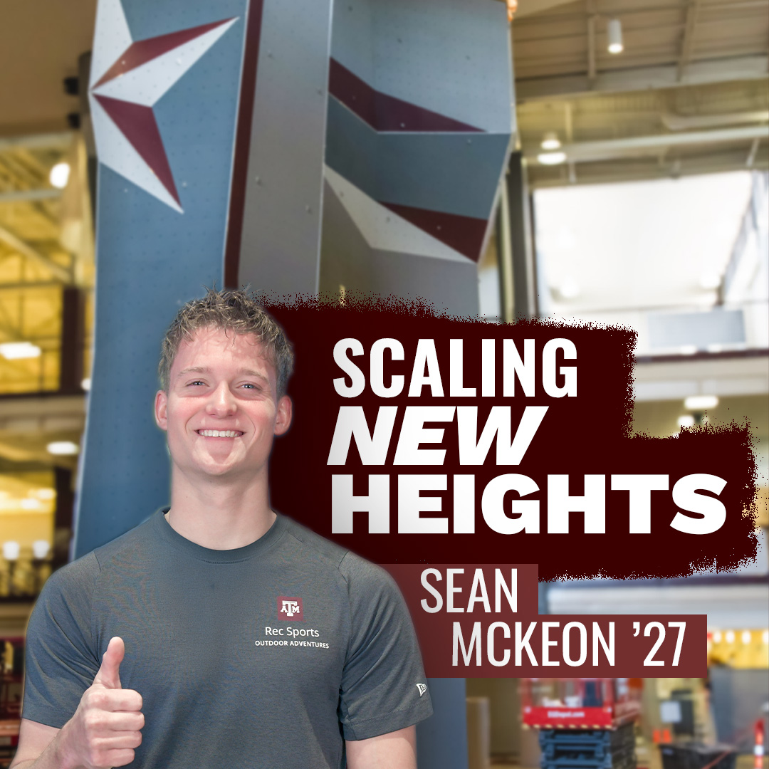 Sean McKeon ’27 smiling and giving a thumbs-up in front of the new Texas A&M climbing wall with text reading “Scaling New Heights.”