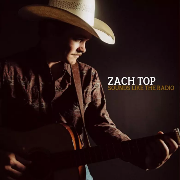 Promotional image for Zach Top's album 'Sounds Like The Radio,' featuring the artist holding a guitar, dressed in a cowboy hat and a dark shirt, against a shadowy background.