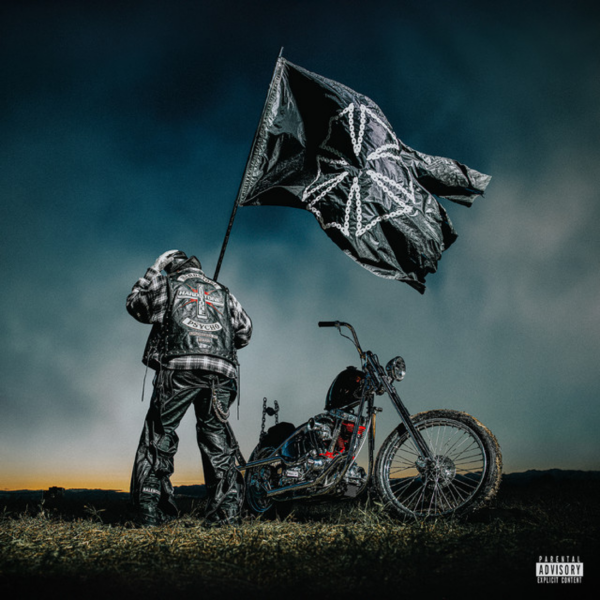 Promotional artwork for the album 'Mr. Morale & the Big Steppers' by Kendrick Lamar, featuring an individual next to a motorcycle under a stormy sky, holding a large flag with a geometric pattern.