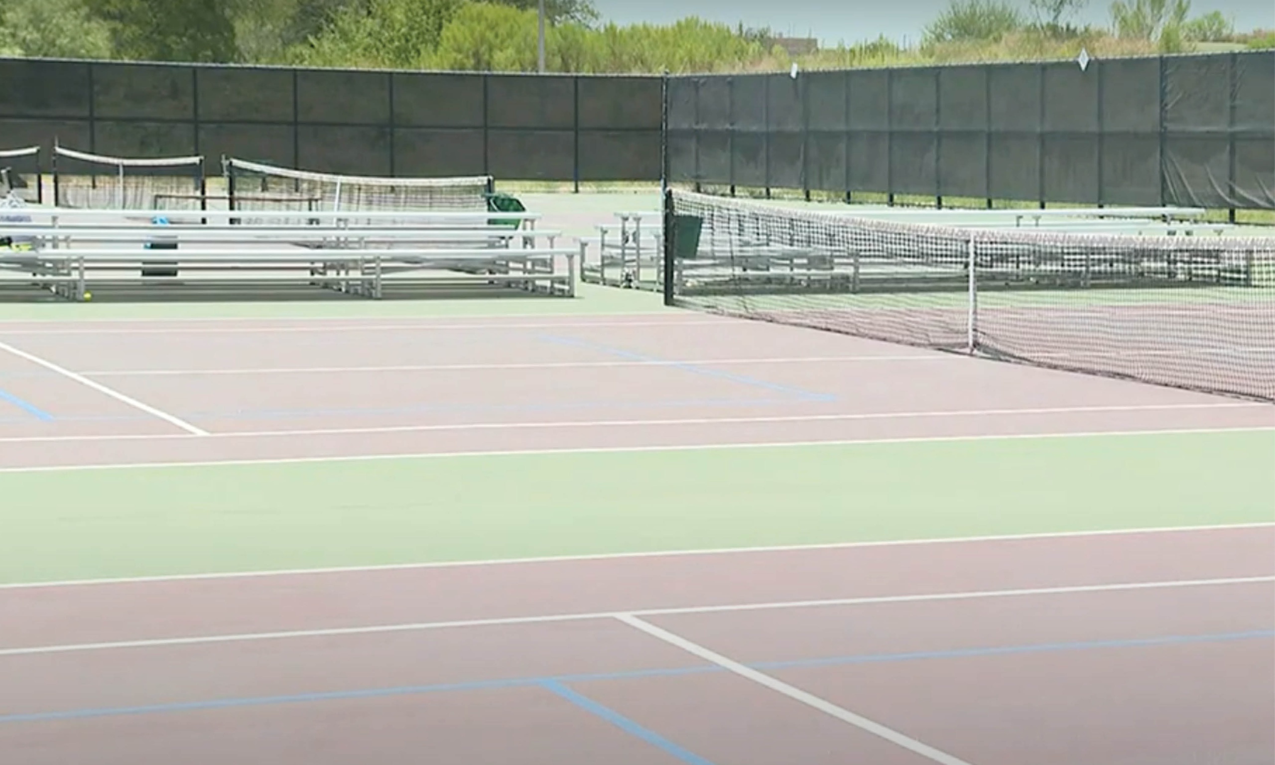 Tennis courts at modern facility.